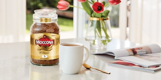 moccona classic medium roast coffee flowers table